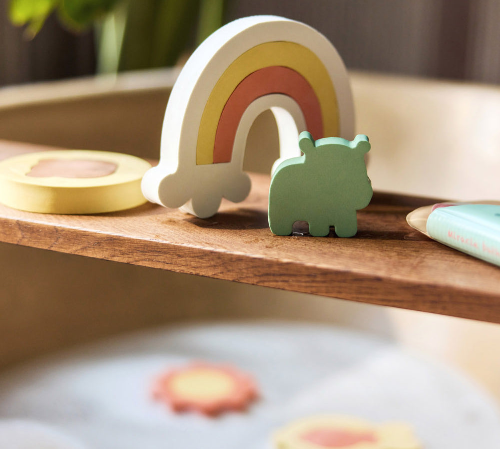 Jollein Kangaroots rainbow and animal bath puzzle pieces displayed on a wooden bath tray