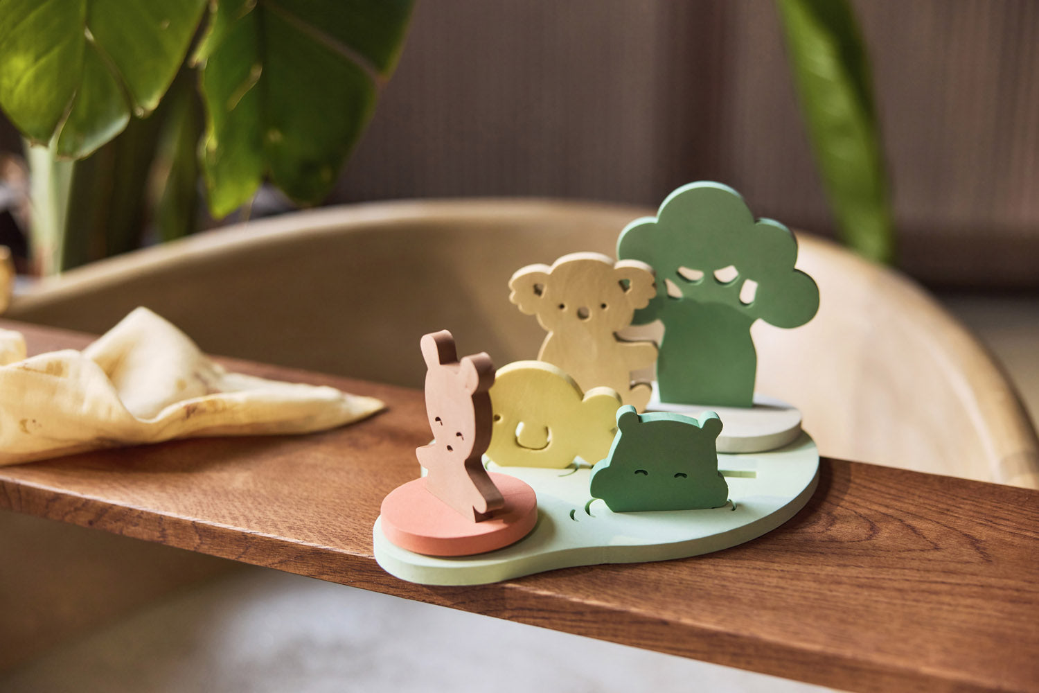 Jollein Kangaroots bath foam playset with animal and tree figures on a wooden bath tray
