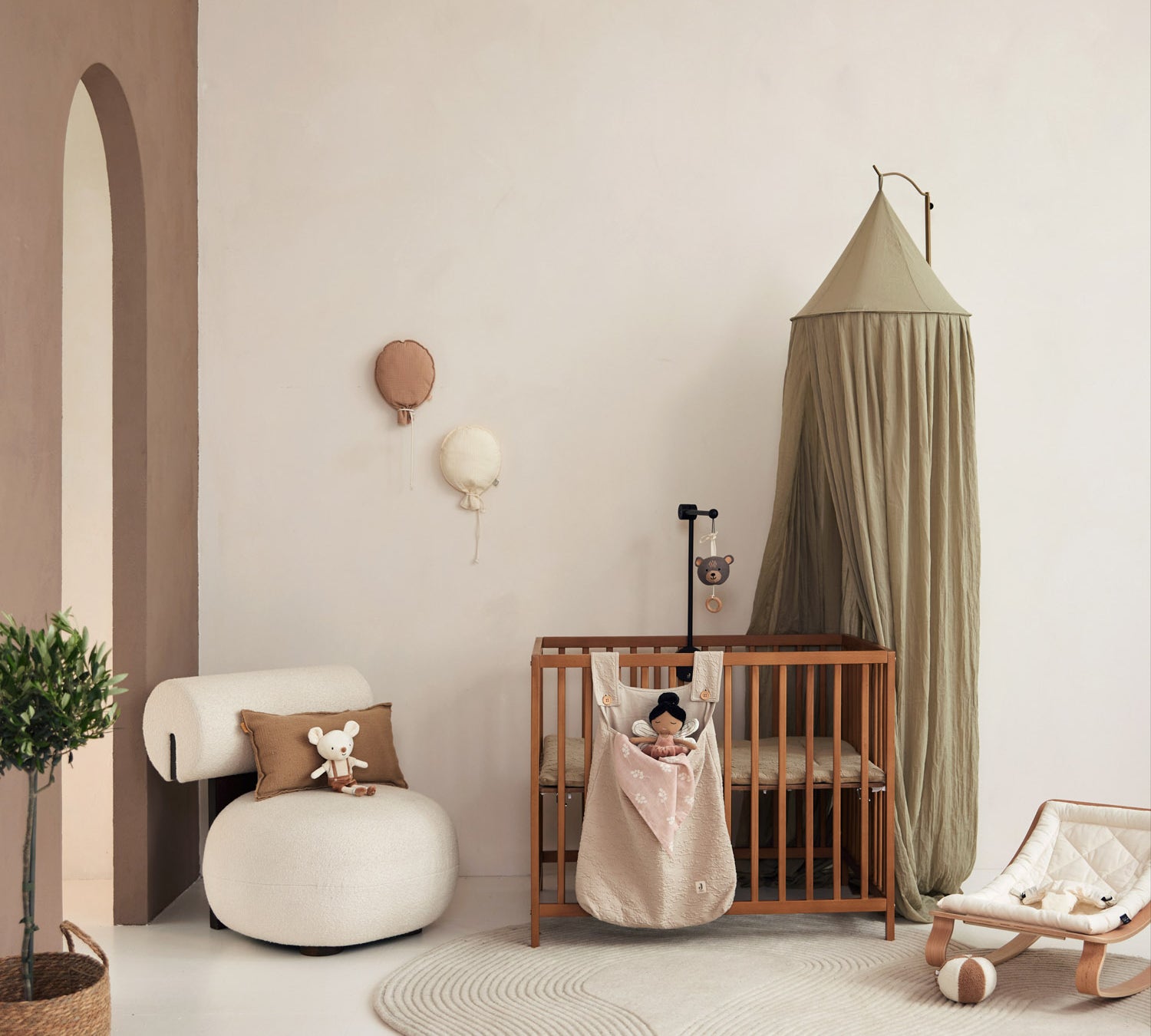 Jollein Canopy olive green above a crib
