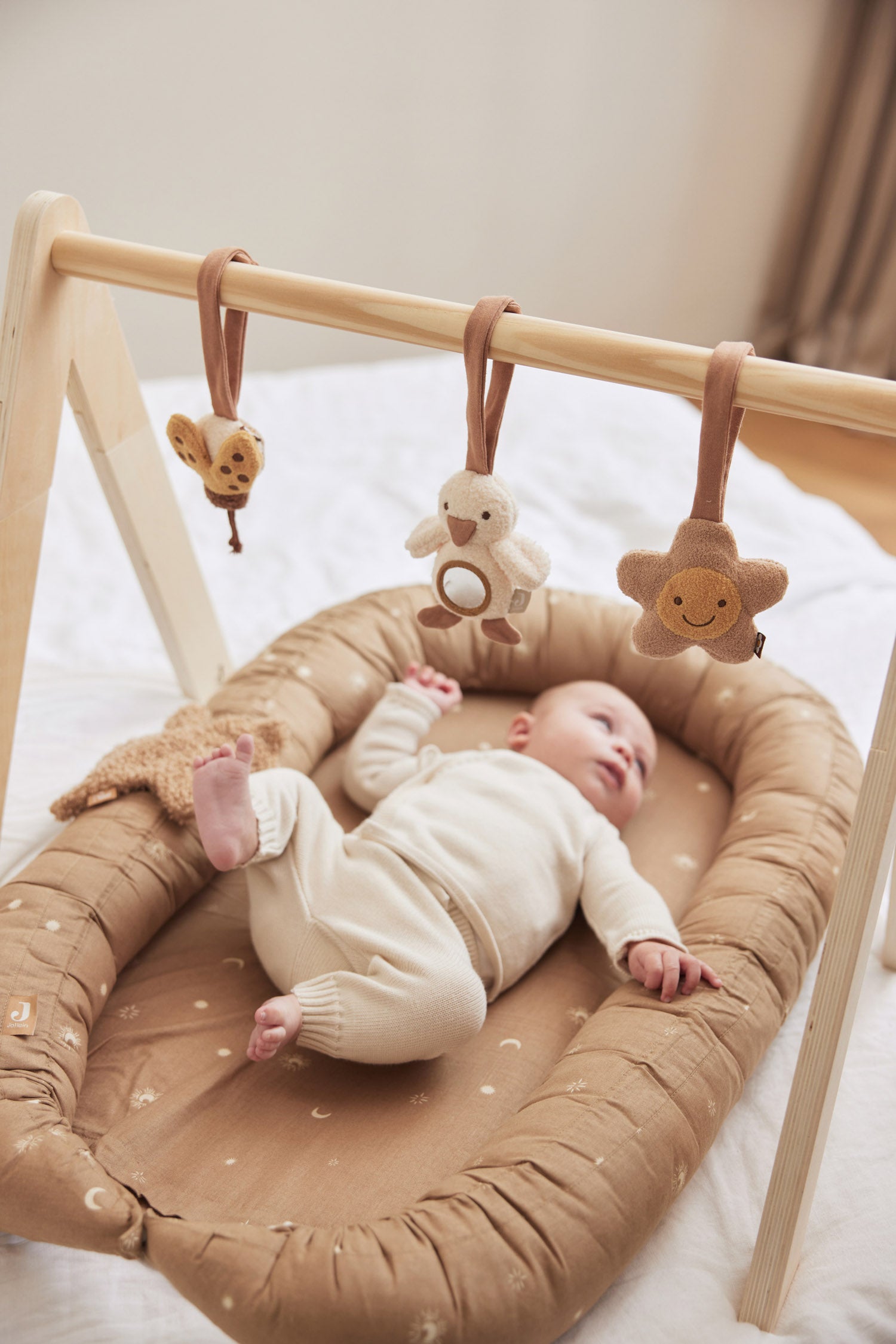 baby with Jollein wooden baby gym