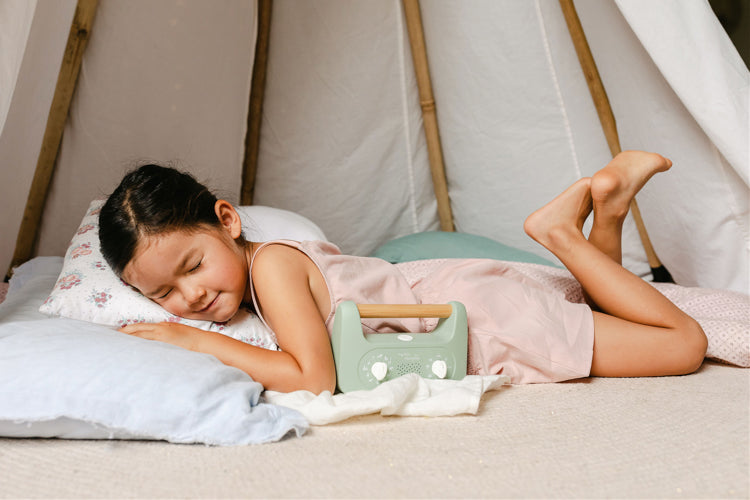 Kid in sun with the My Little Morphee Childrens Sleep and Meditation Box