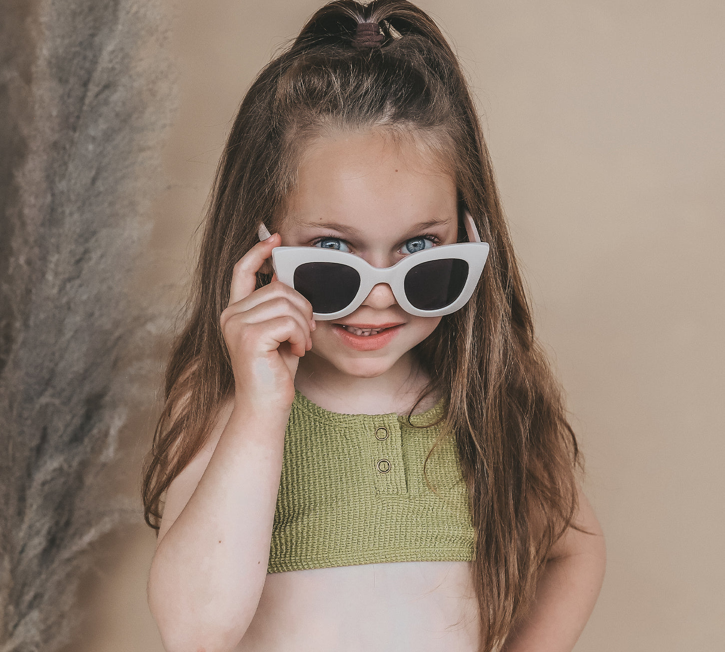 Kids wearing Salted Stories Cat Eye sunglasses in White Swan lifestyle image