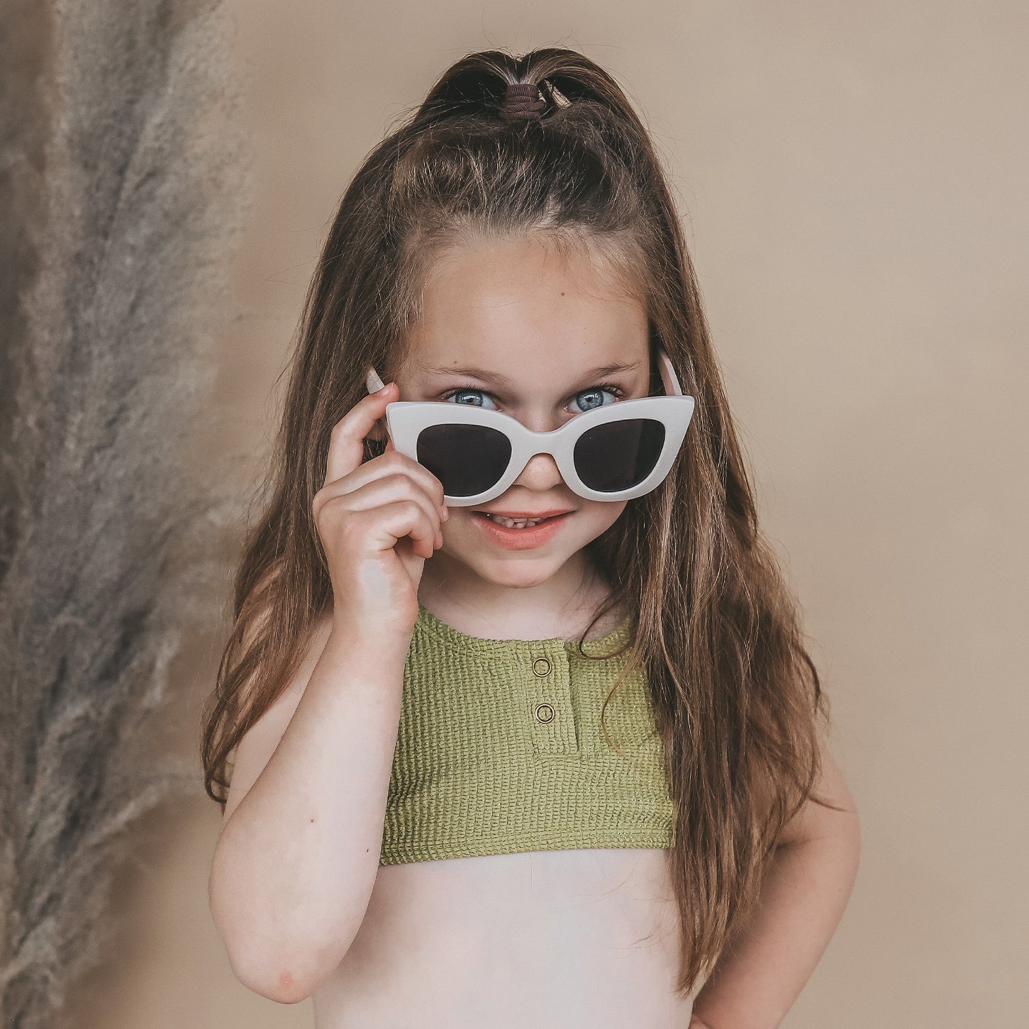 Kids wearing Salted Stories Cat Eye sunglasses in White Swan lifestyle image