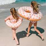 2 girls with Swim Essentials 55cm Swim Ring Flower Hearts 